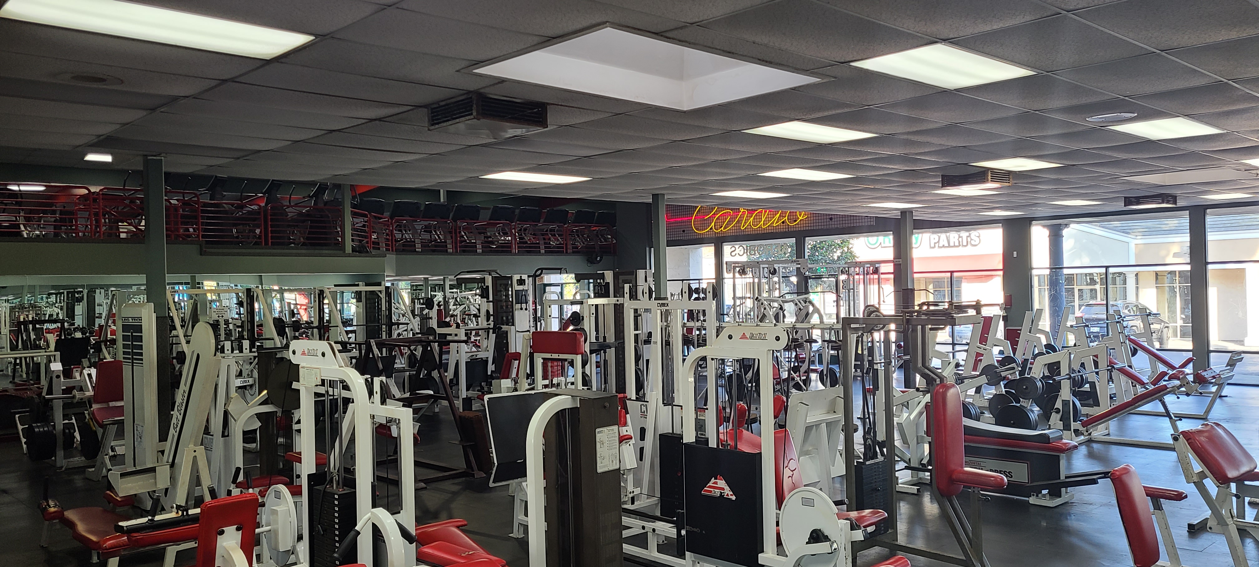 Free weights and training stations across the Ultimate Fitness floor.