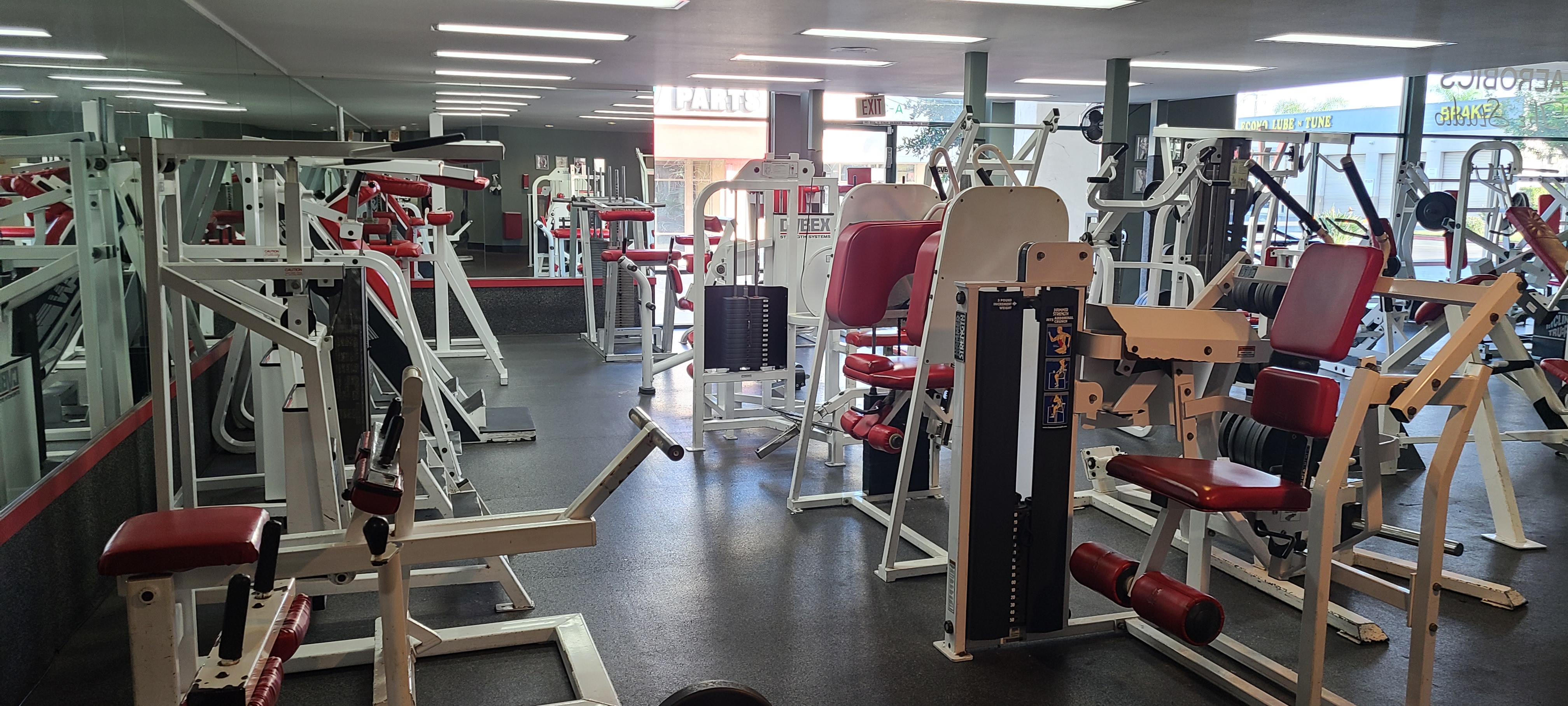 Open training floor and functional equipment at the back of the gym.